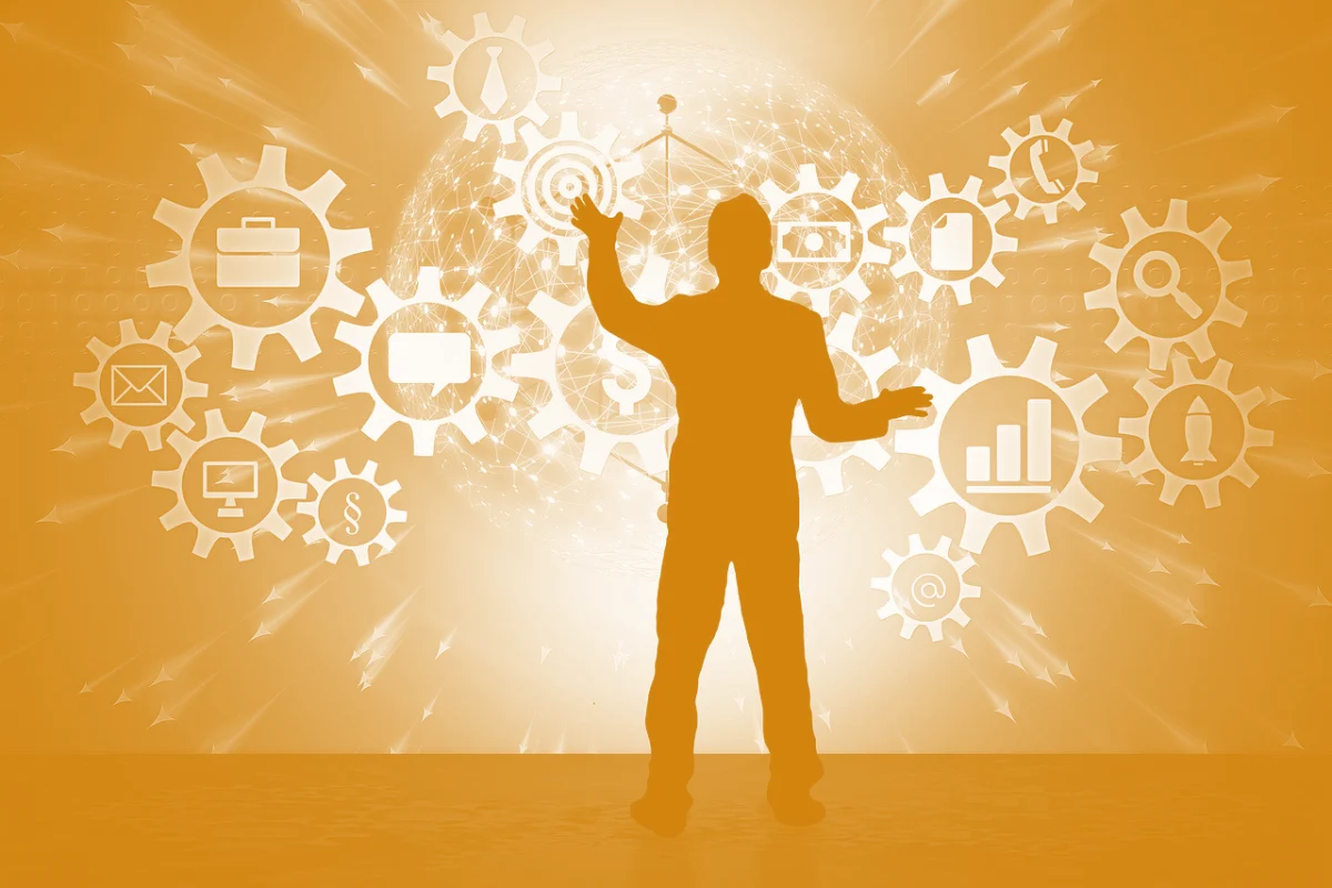Man standing in front of screen depicting various IoT networks and software.