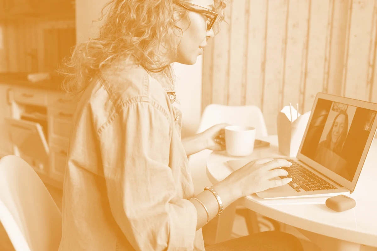 Image depicting a woman engaging in a video call via RTMP or WebRTC protocols.